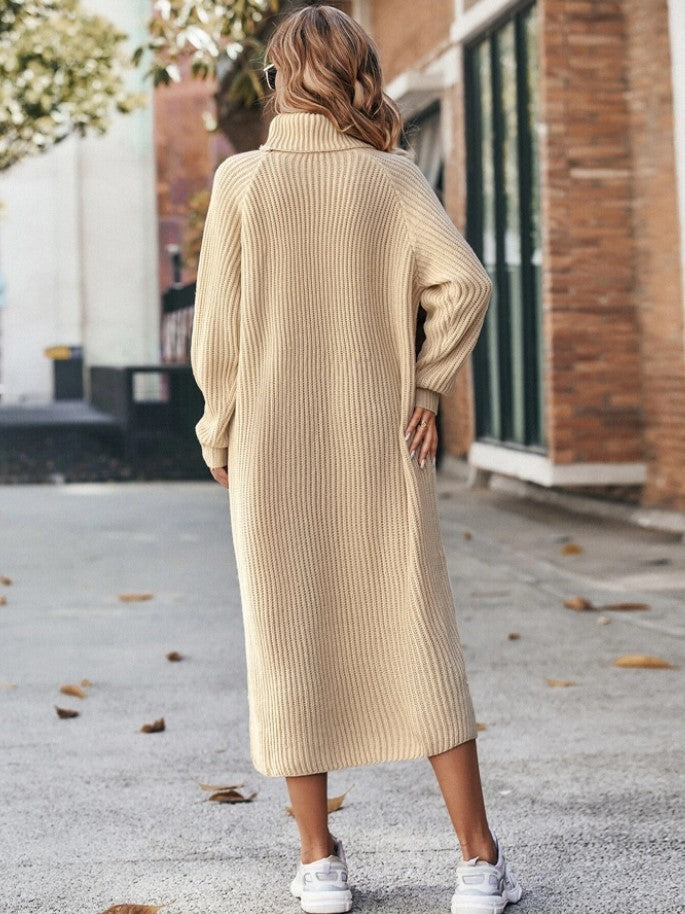 Woman in a long roll neck jumper dress