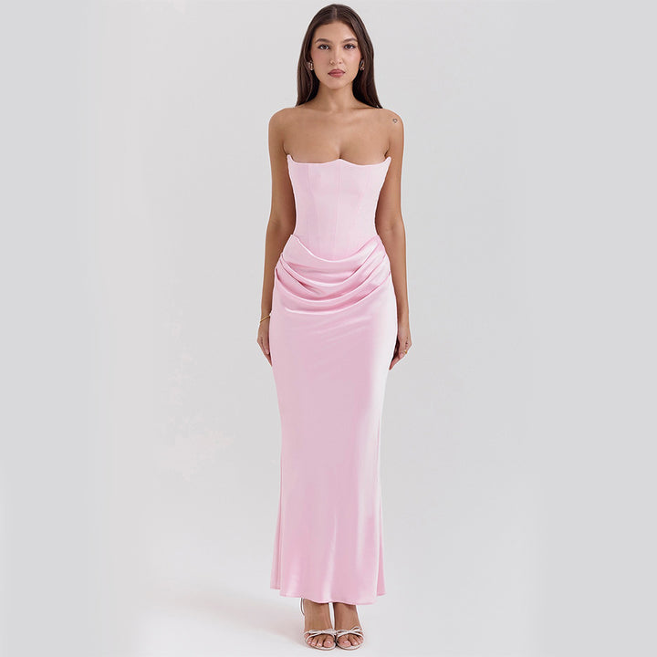 Woman in a strapless satin maxi dress