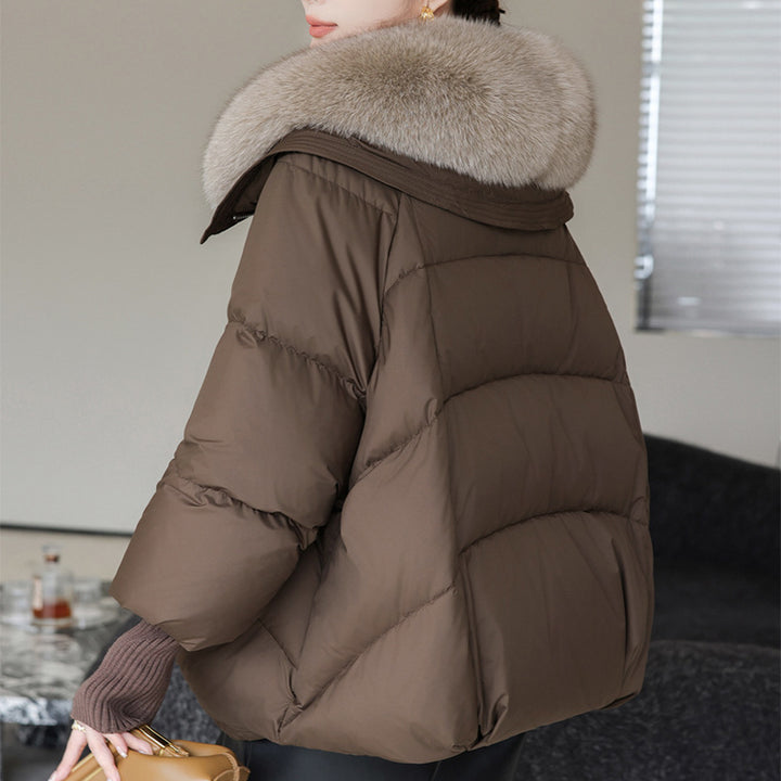 Woman in short puffer jacket with fur collar