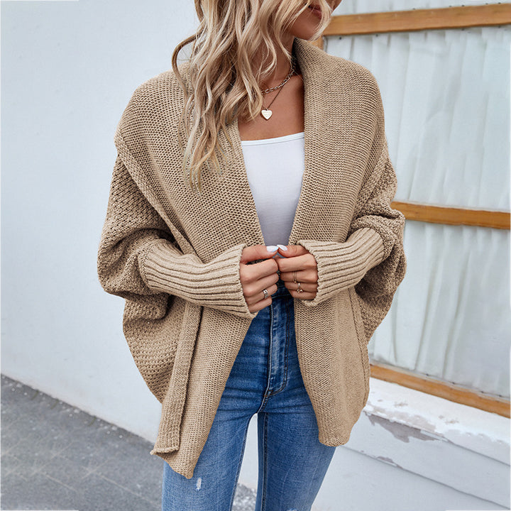 Woman in oversized chunky knit cardigan