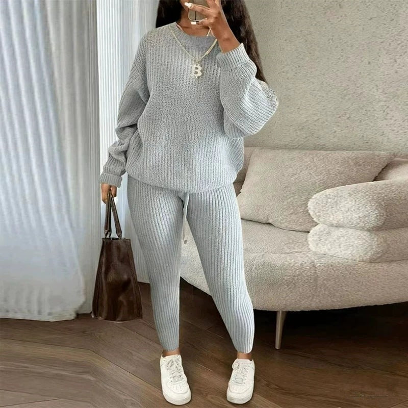 Woman in ribbed knit jumper and trousers set
